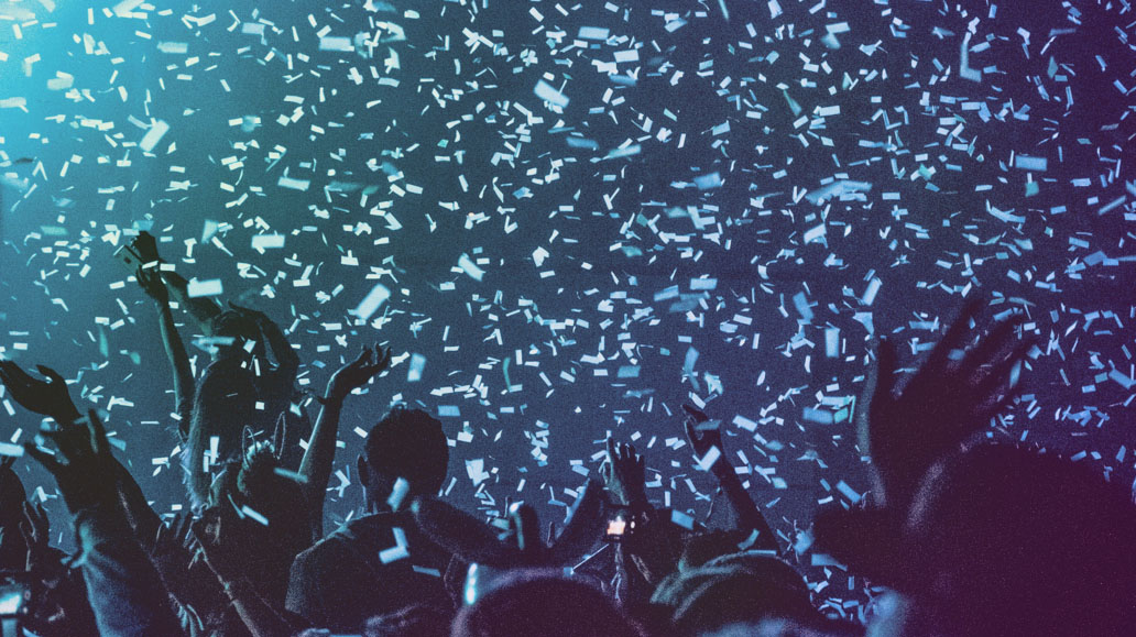blue image of confetti falling at concert
